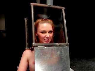 BDSM divinity with head in steel box spaked