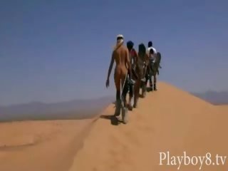 Group of fantastic playmates sandboarding and tryout fishing